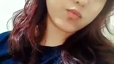 Beautiful girl lifting dress and showing big boobs